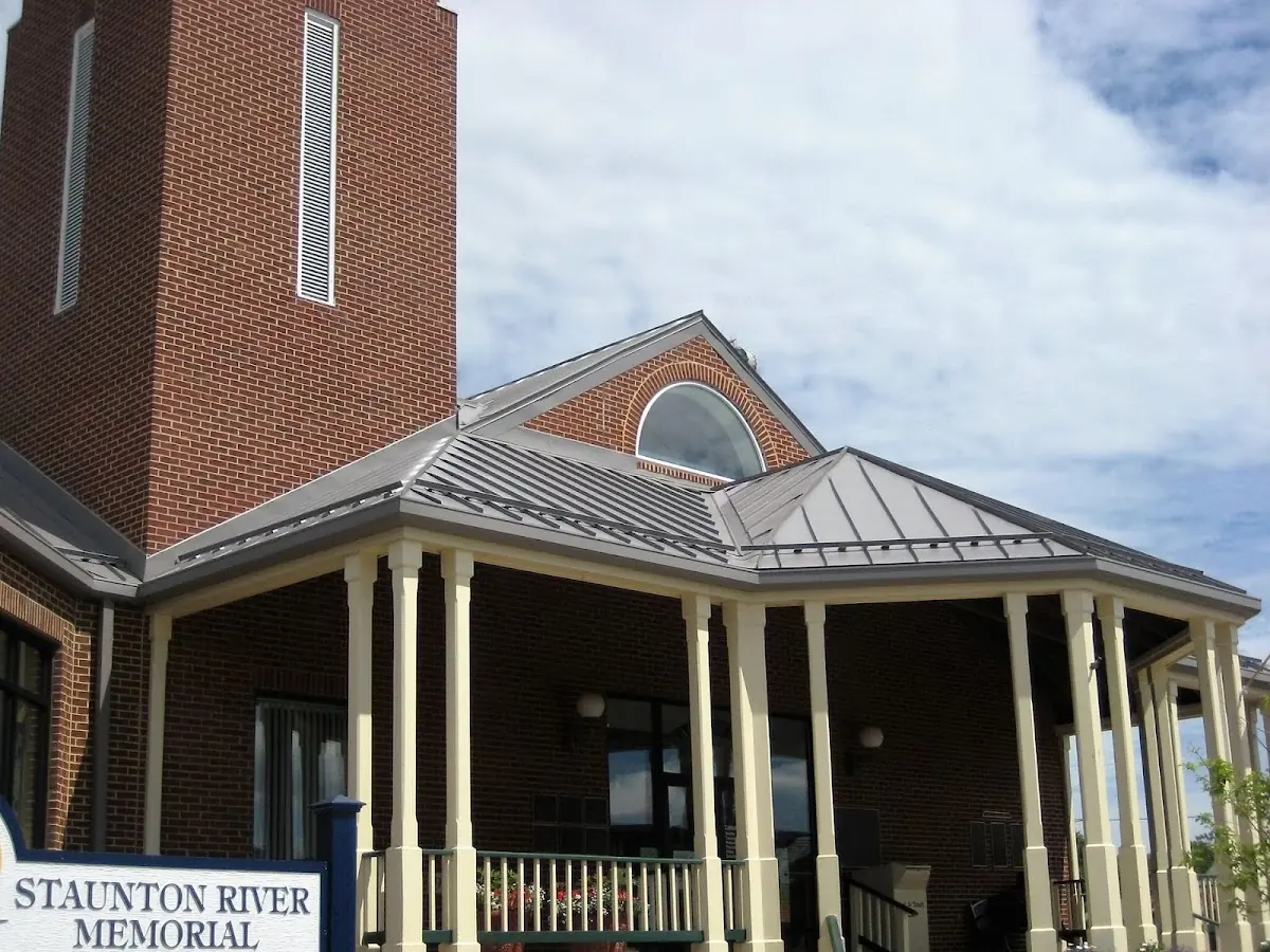 Skilled roofing craftsmen working on a residential roof in Charles Town